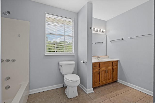 full bathroom featuring tile patterned floors, toilet, vanity, baseboards, and shower / bathtub combination