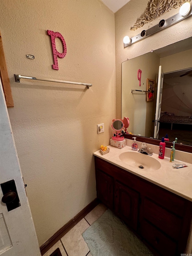 1530 Pearcy Rd, Pearcy, AR 71964 - bathroom with tile patterned floors, baseboards, and vanity