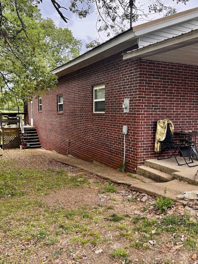 1530 Pearcy Rd, Pearcy, AR 71964 - view of side of property featuring a wooden deck and brick siding