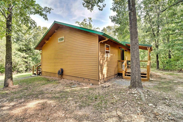 view of side of property with a deck