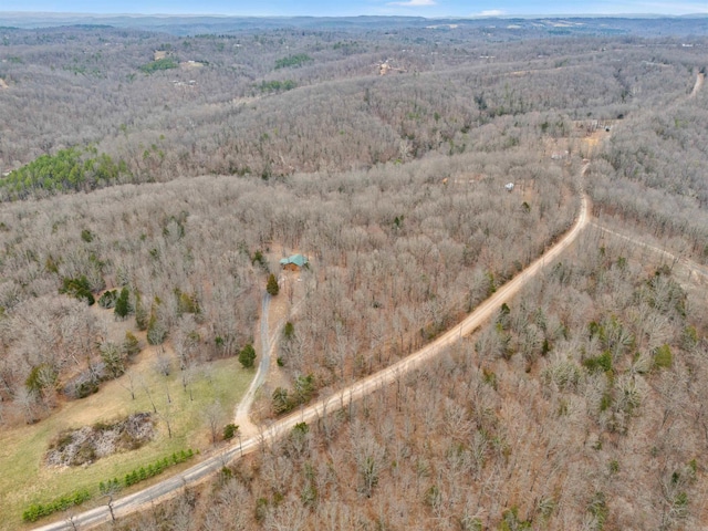 aerial view featuring a wooded view