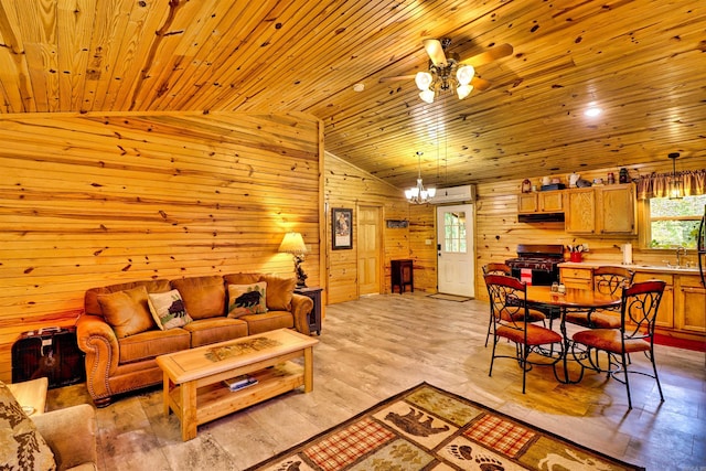 living room with wooden walls, lofted ceiling, wood ceiling, a wall mounted air conditioner, and a chandelier