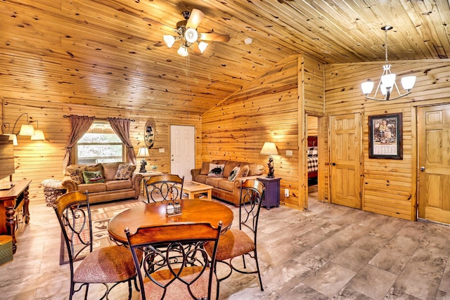 dining area with light wood-style floors, wooden walls, wooden ceiling, and ceiling fan with notable chandelier