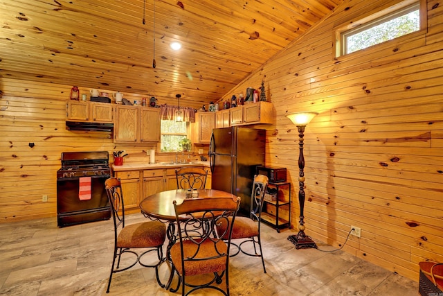 dining space featuring wood walls, wood ceiling, and lofted ceiling