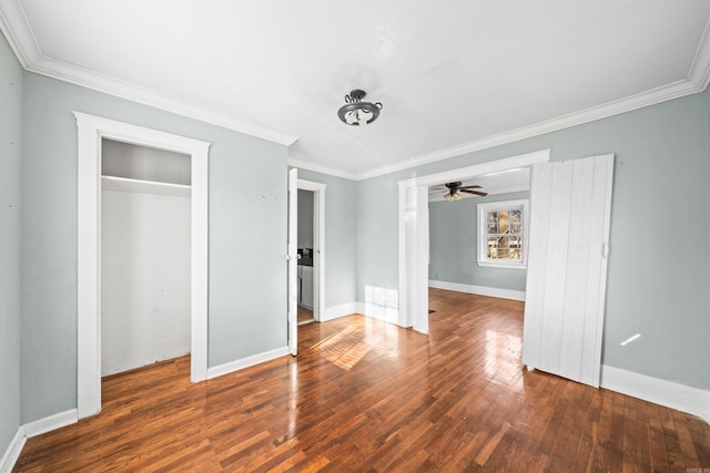 unfurnished bedroom featuring a closet, wood-type flooring, and ornamental molding