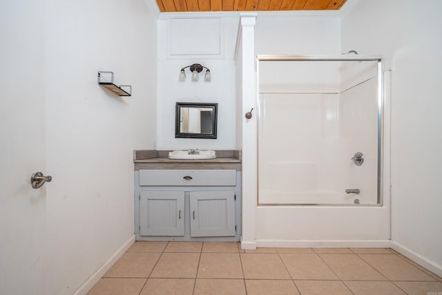 bathroom with vanity, washtub / shower combination, baseboards, ornamental molding, and tile patterned flooring