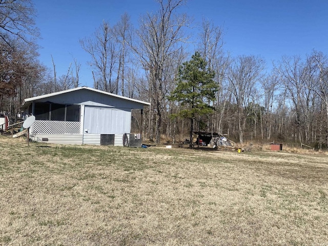 view of yard featuring a sunroom