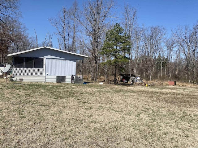 view of yard featuring a sunroom