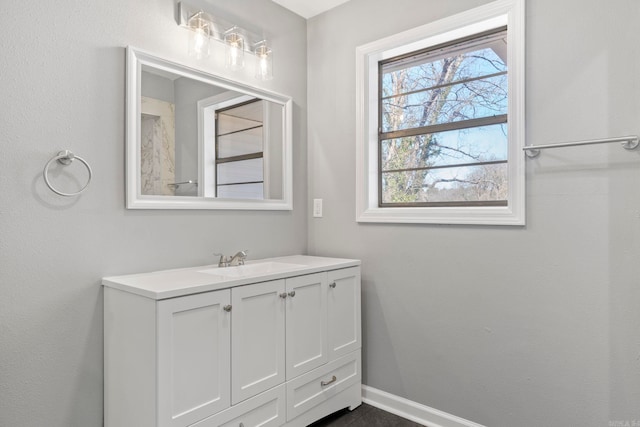 bathroom featuring vanity and baseboards