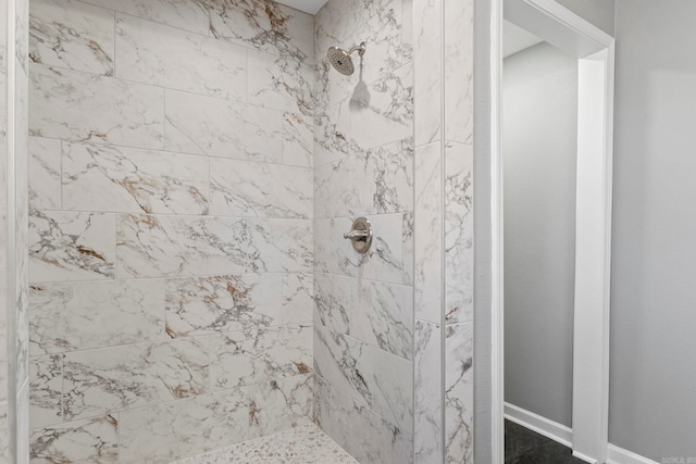 bathroom with a tile shower