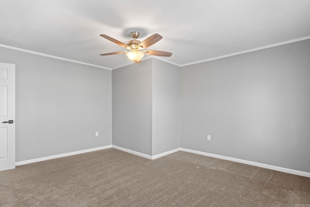 unfurnished room featuring carpet, crown molding, a ceiling fan, and baseboards