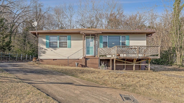 manufactured / mobile home featuring crawl space and driveway