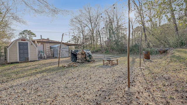 view of yard with a storage unit and an outdoor structure