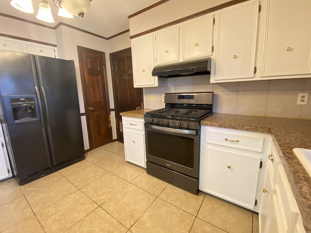 kitchen with stainless steel gas range, decorative backsplash, under cabinet range hood, white cabinetry, and black refrigerator with ice dispenser