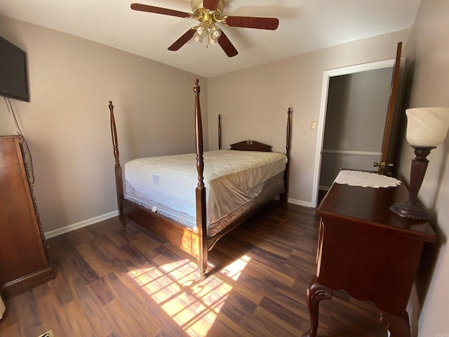 bedroom with wood finished floors, baseboards, and ceiling fan