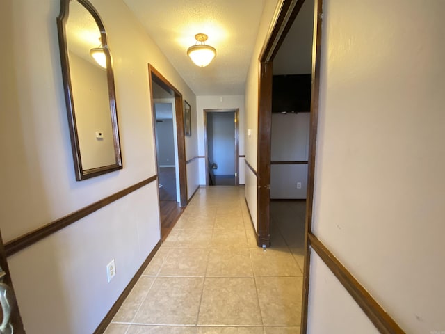 hallway with light tile patterned floors