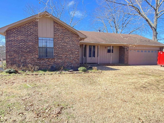 ranch-style house with driveway, brick siding, an attached garage, and a front lawn