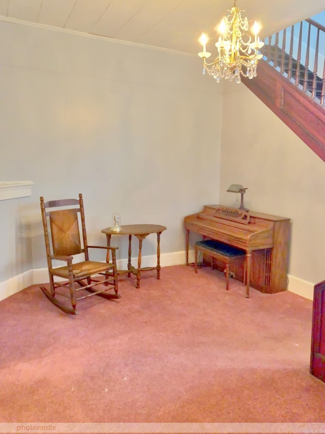 living area with baseboards, stairway, carpet floors, and an inviting chandelier