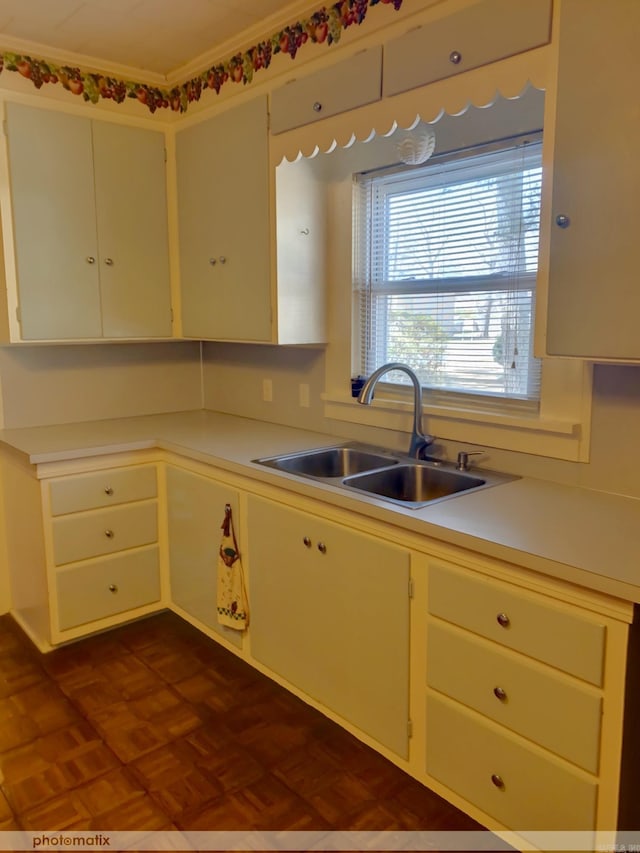 kitchen with a sink and light countertops