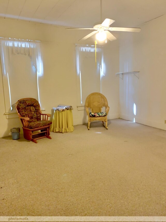 unfurnished room featuring carpet and ceiling fan