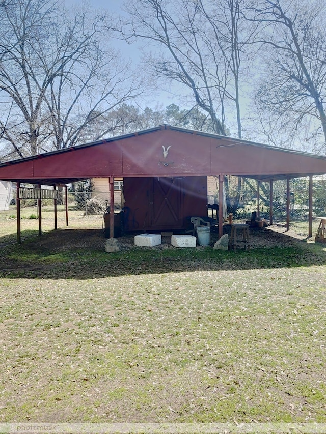 view of outdoor structure with an outbuilding and a carport