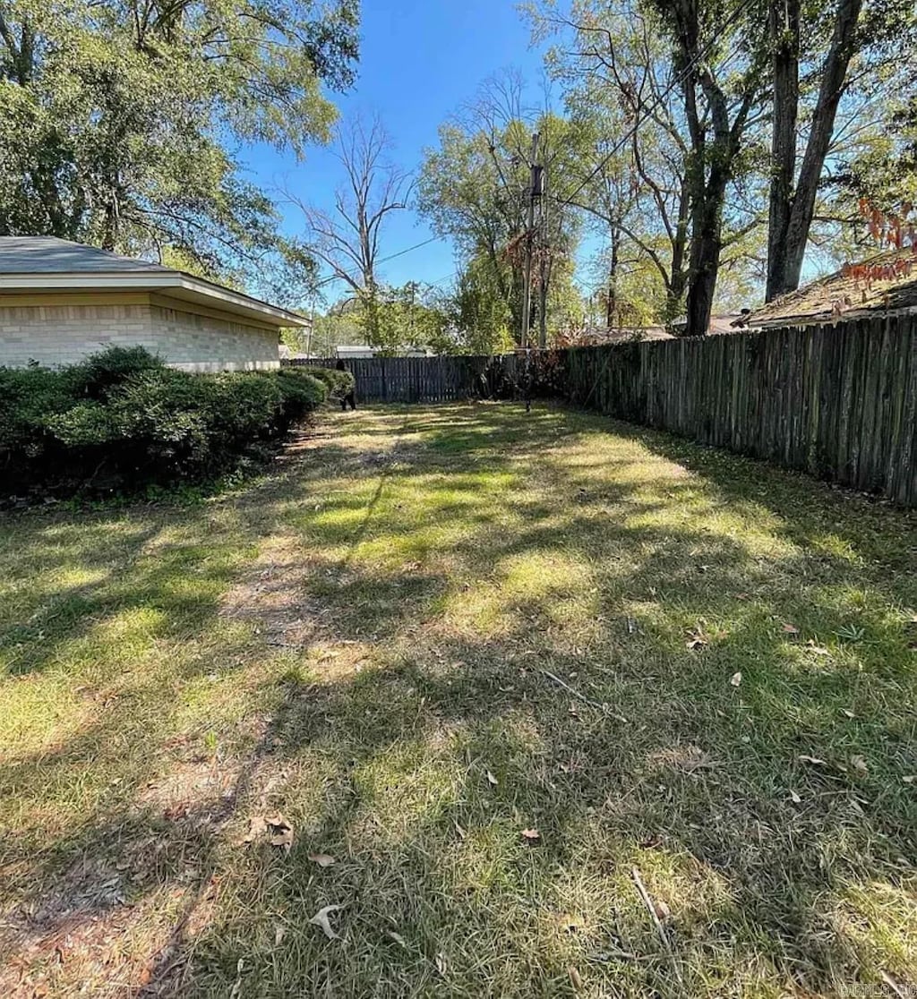 view of yard with a fenced backyard