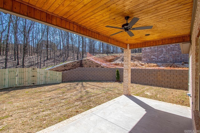 view of yard featuring a patio area, a fenced backyard, and ceiling fan