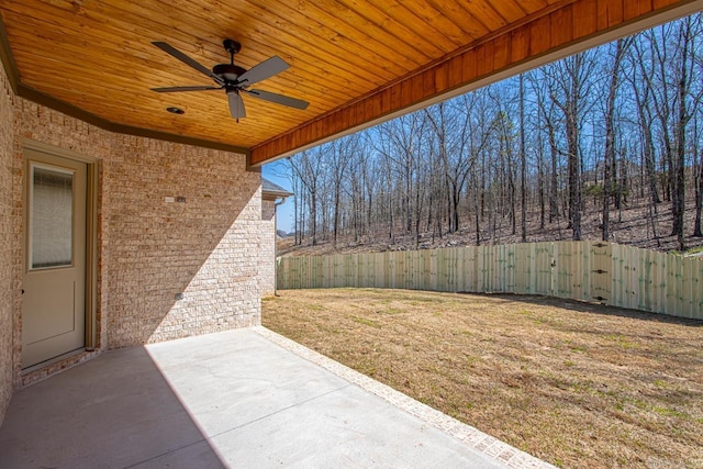 view of patio with a fenced backyard and a ceiling fan