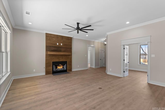 unfurnished living room featuring visible vents, baseboards, ceiling fan, ornamental molding, and light wood-style floors