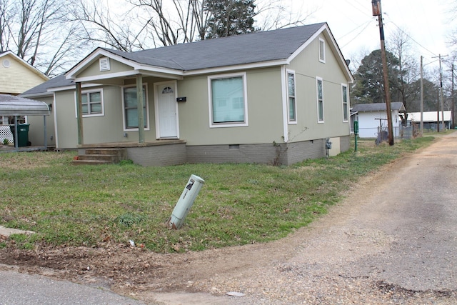 bungalow featuring a shingled roof, a front lawn, covered porch, and crawl space