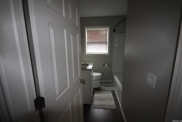 bathroom with toilet, vanity, and shower / bathing tub combination