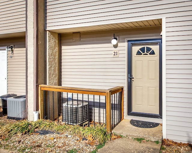 property entrance featuring central AC unit