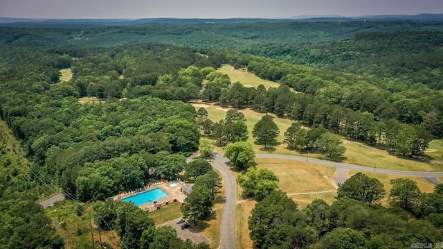 bird's eye view featuring a wooded view