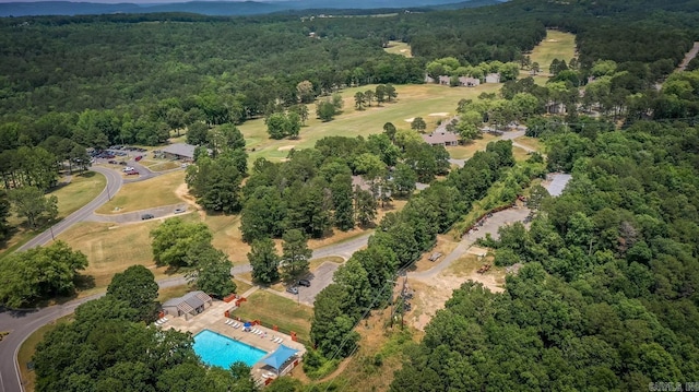 bird's eye view featuring a wooded view