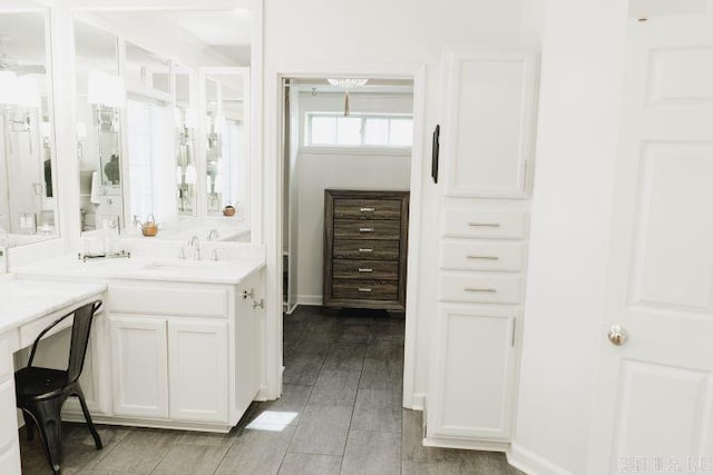 bathroom featuring vanity and baseboards