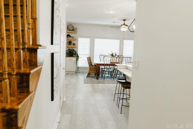 interior space featuring a ceiling fan