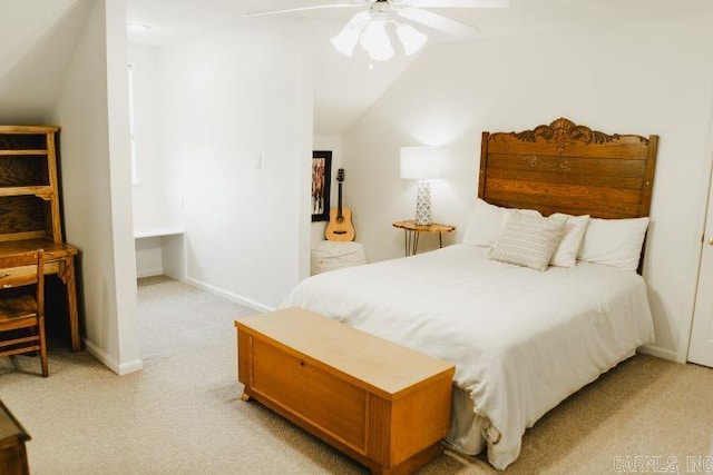 bedroom with a ceiling fan, lofted ceiling, light colored carpet, and baseboards