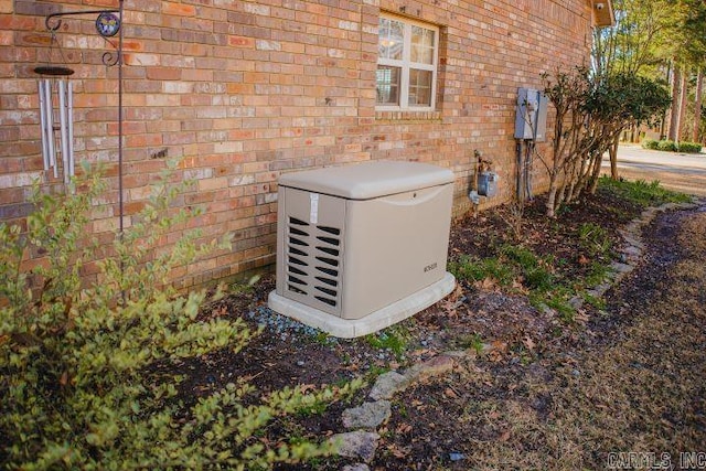 details featuring brick siding and a power unit