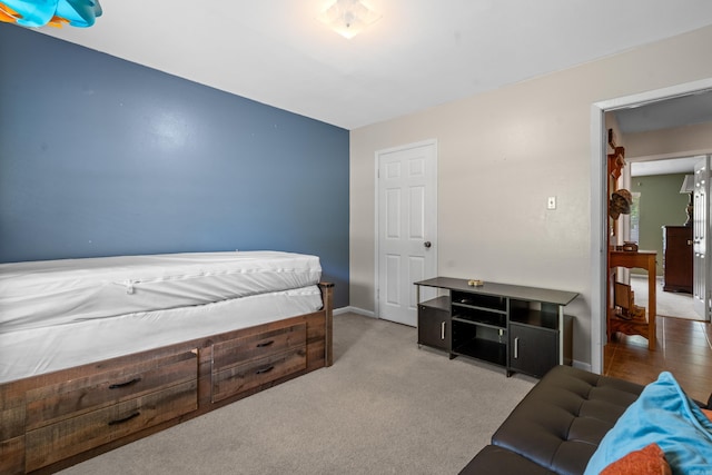 carpeted bedroom with baseboards