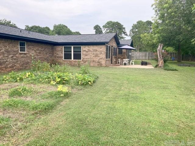 view of yard with a patio and fence