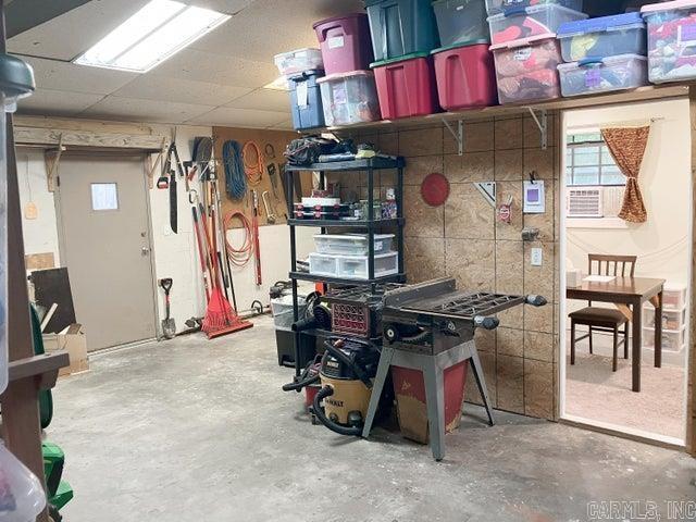 basement featuring a paneled ceiling