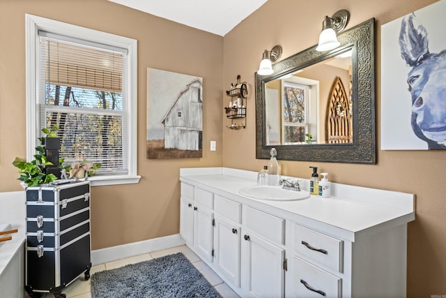 bathroom with tile patterned flooring, vanity, and baseboards