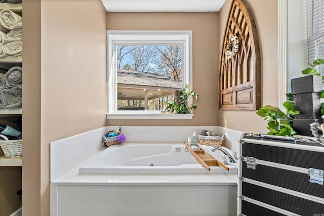 full bathroom with a whirlpool tub