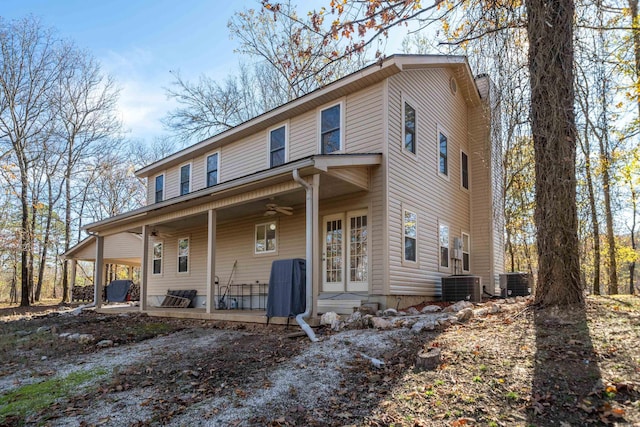 view of front of house with cooling unit, covered porch, and a ceiling fan