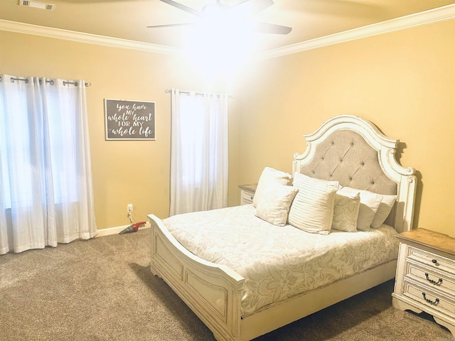 bedroom with ceiling fan, visible vents, carpet floors, and ornamental molding