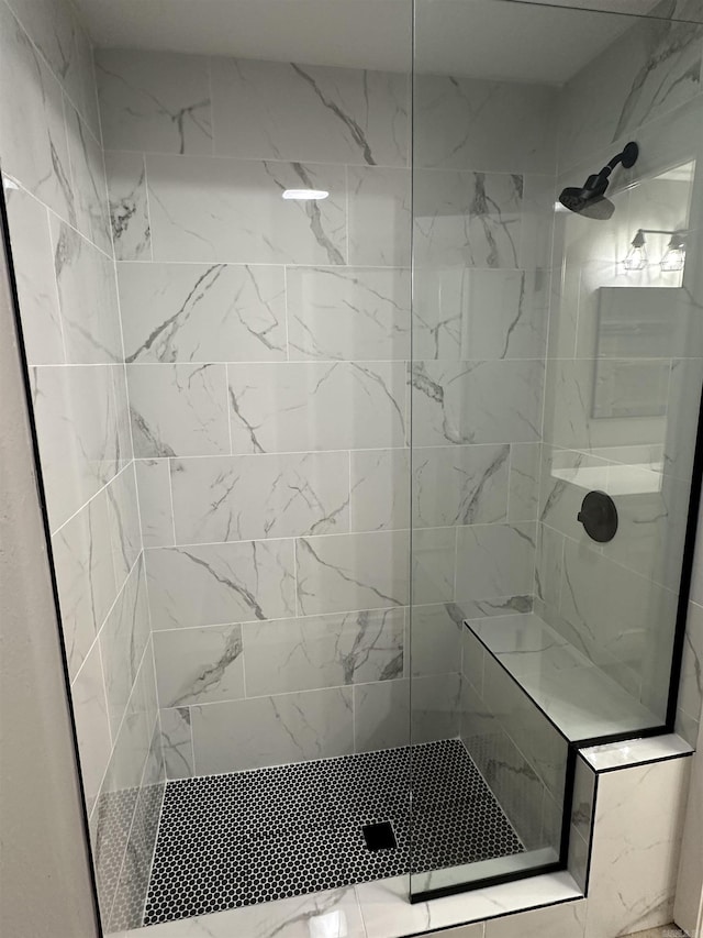 bathroom with a shower stall