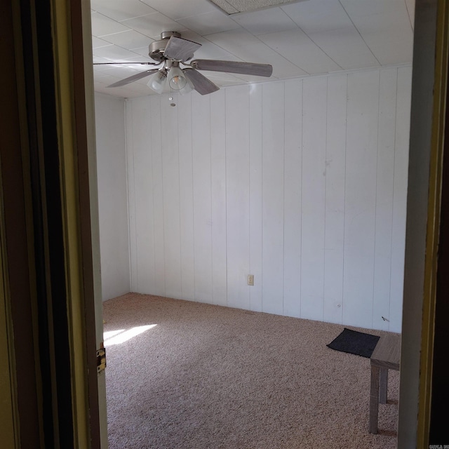 empty room with carpet floors and ceiling fan