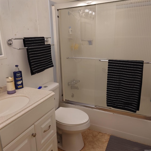 full bathroom with enclosed tub / shower combo, toilet, tile patterned floors, and vanity