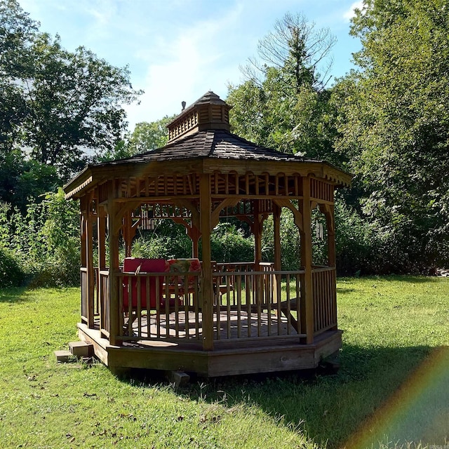 view of property's community with a gazebo and a lawn