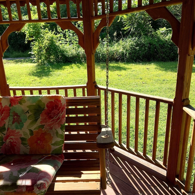 wooden terrace with a yard